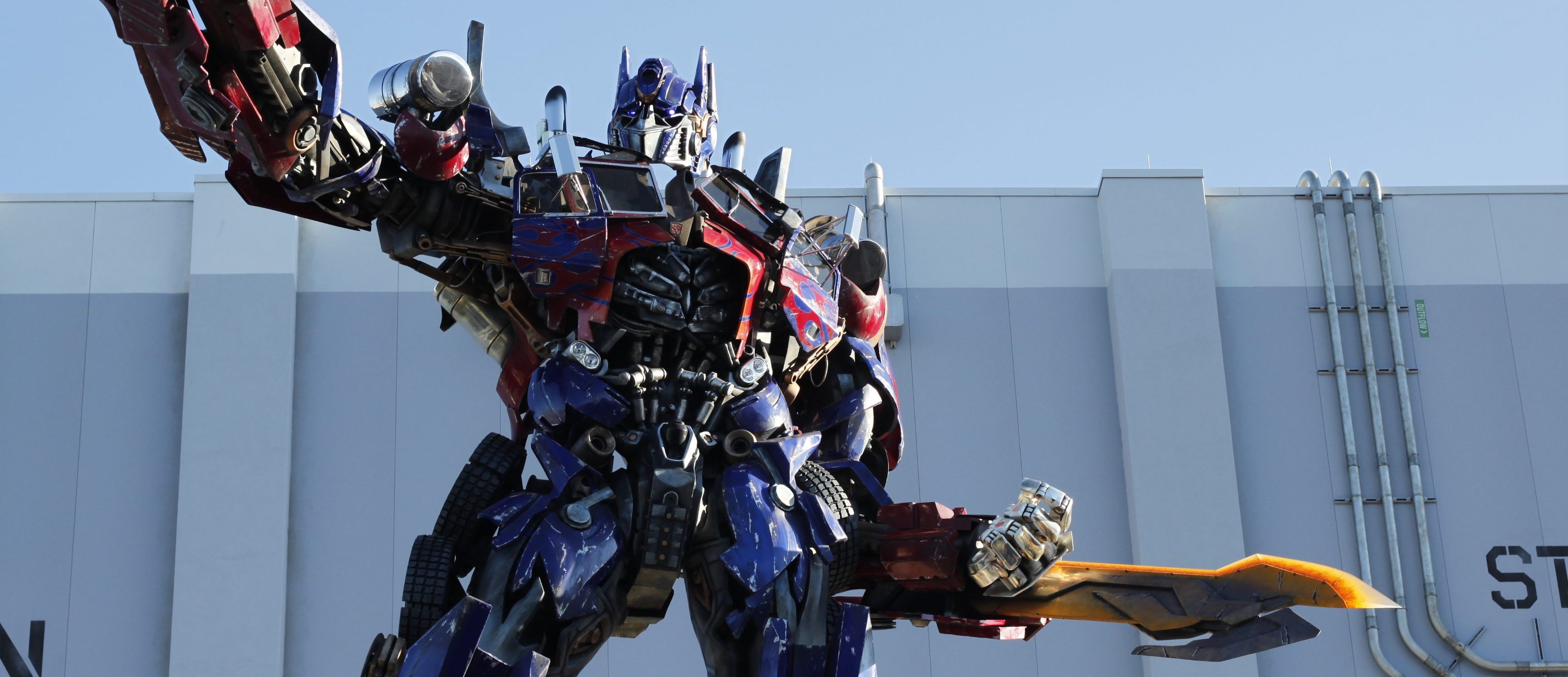 optimus prime with sword pointing out