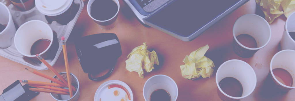 leftover coffee at an office desk with cup tipped over
