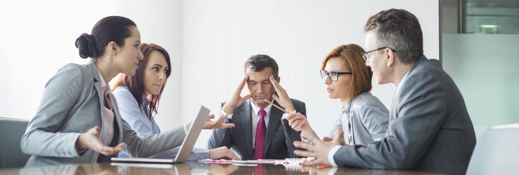 Businesspeople arguing in meeting