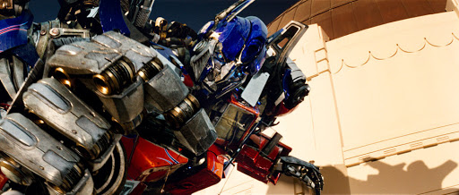 Optimus prime with his hand clenched article banner for manual vs automated business processes